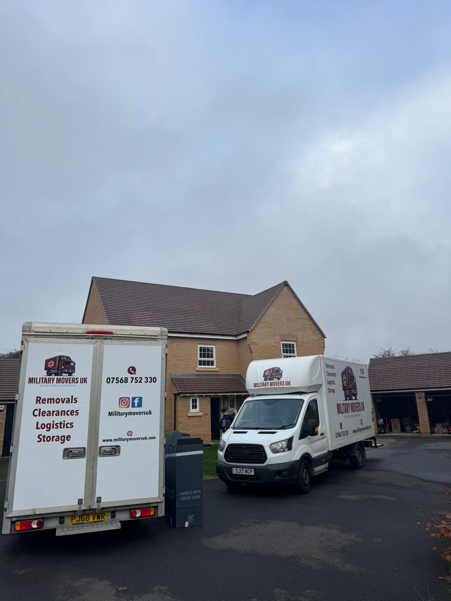 two military movers uk lorries during a house removals in Slough