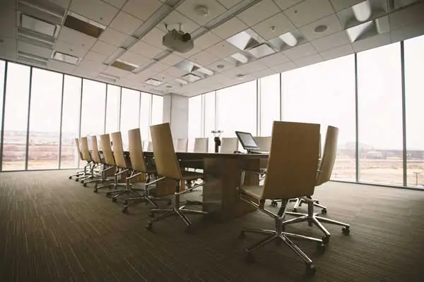 Empty modern boardroom with meeting table and chairs, ready for an office move with Military Movers UK